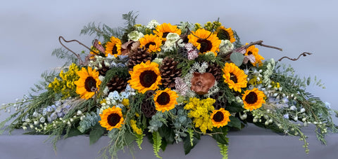 #109 Golden Meadow Half Casket Spray