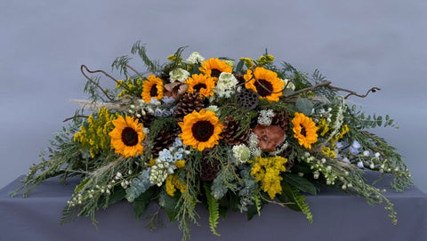 #109 Golden Meadow Half Casket Spray