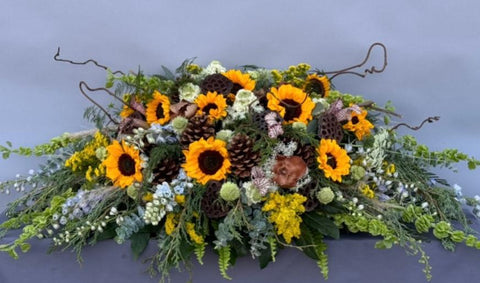 #109 Golden Meadow Half Casket Spray