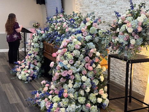 # 269 Full Cascading Casket Floral Installation in Pink, Blue & White – Luxury Tribute by Marchello’s Floral
