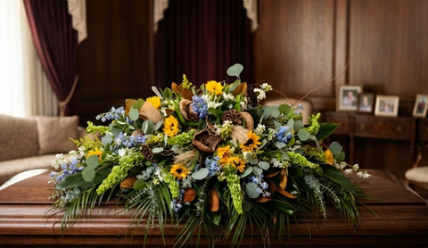 #109 Golden Meadow Half Casket Spray