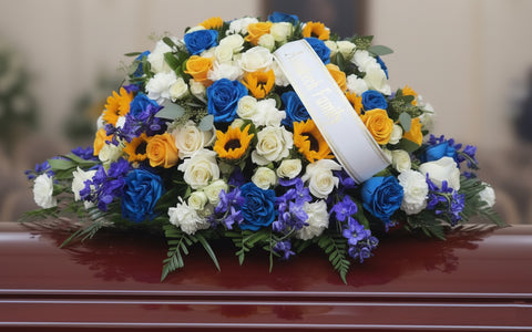 #258 Radiant Sunflower & Blue Rose Half Casket Spray