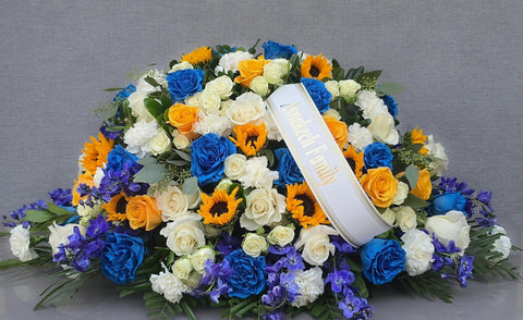 #258 Radiant Sunflower & Blue Rose Half Casket Spray